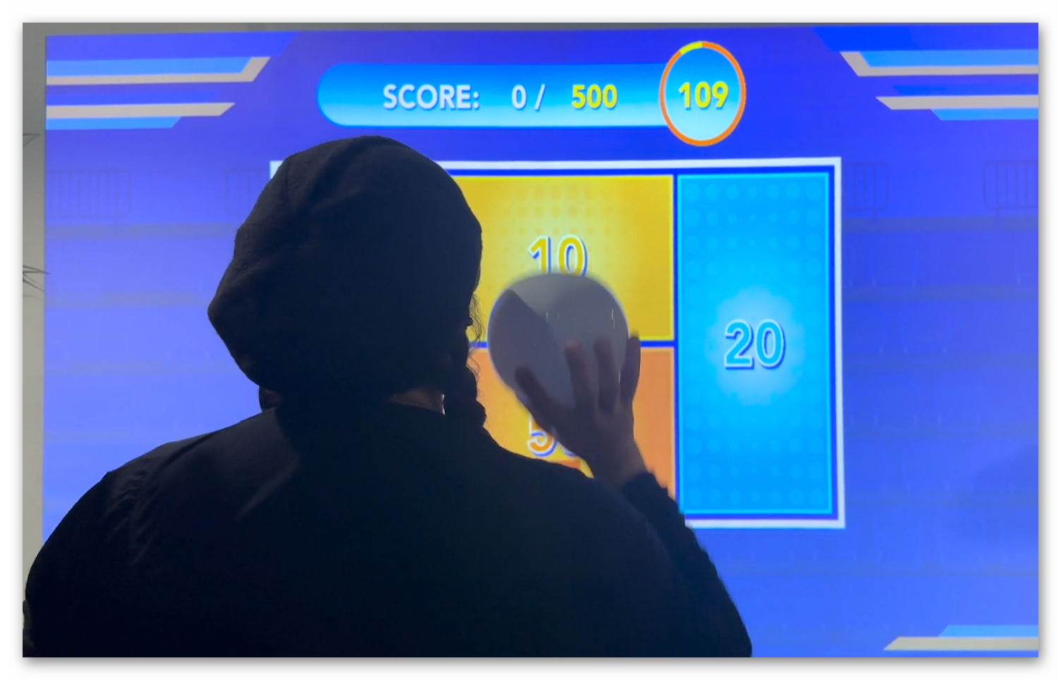 Competitive basketball mode with multiple players at Ball Wall Arena sports gaming installation